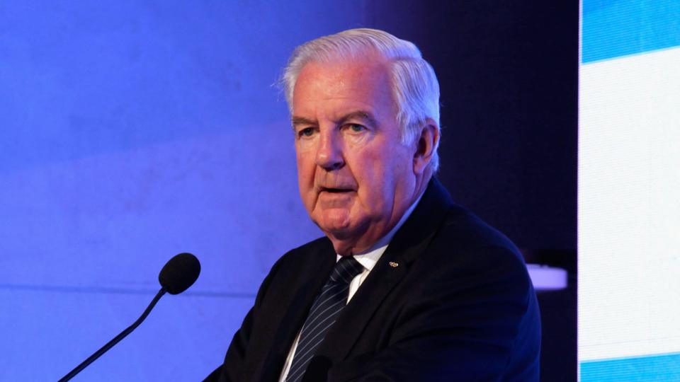 Sir Craig Reedie speaking at a podium in 2018