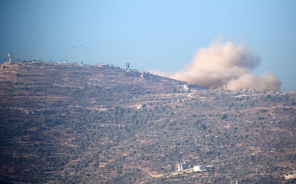 Smoke rises above the occupied West Bank