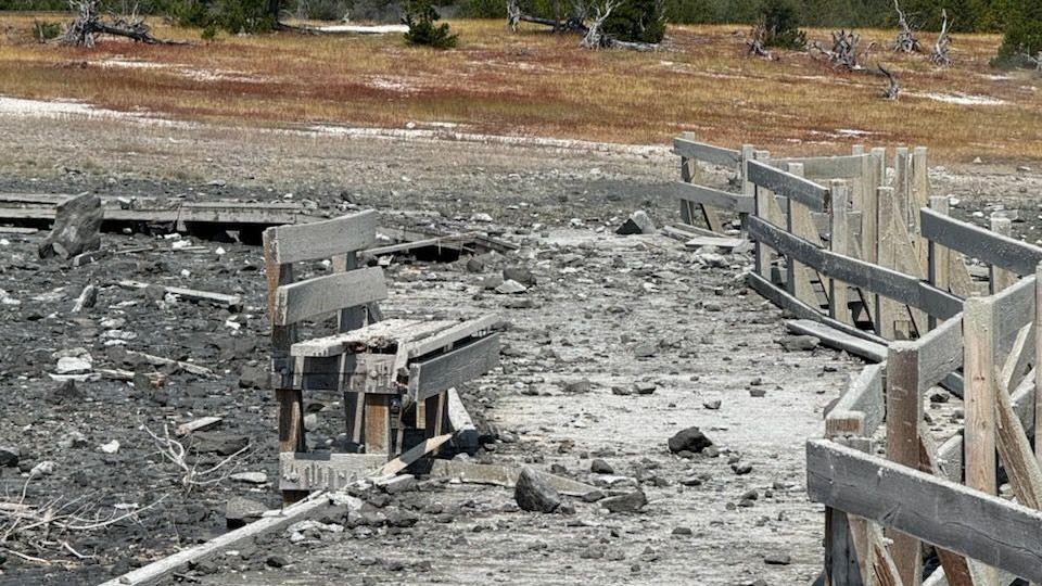 A bench is covered in debris from a hydrothermal explosion at Yellowstone National Park