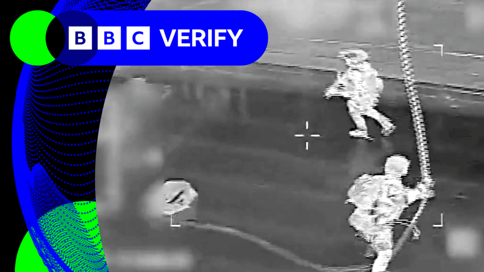 A grab from a video released by the US military showing personnel roping on to a ship