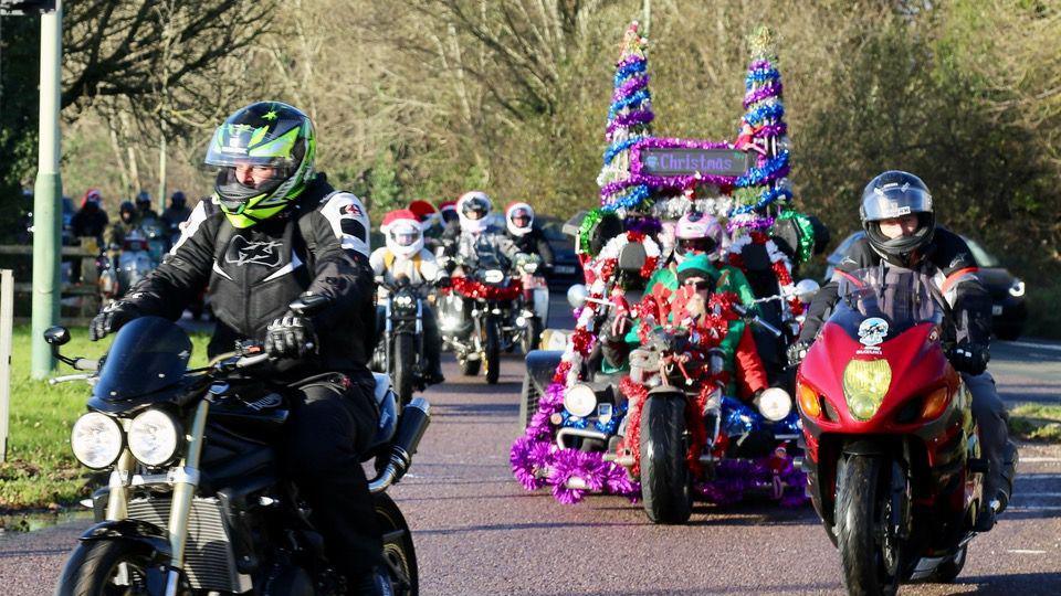 People riding motorbikes in a Christmas theme for charity