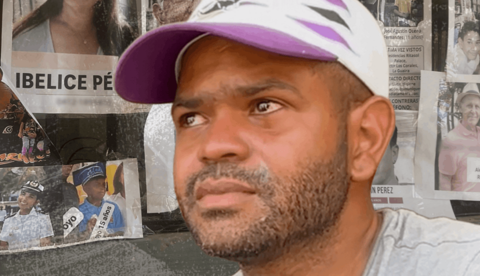 Nelson Torrebella wears a hat and has tears in his eyes in front of posters
