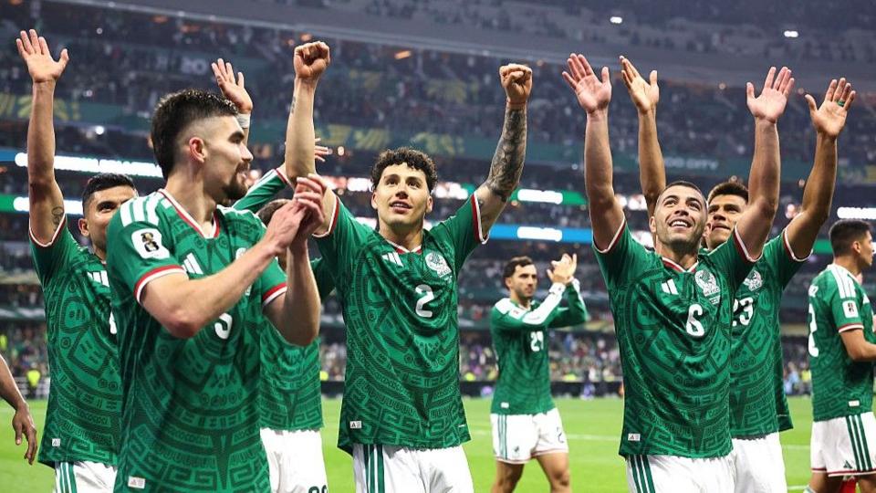 Mexico players raise their hands