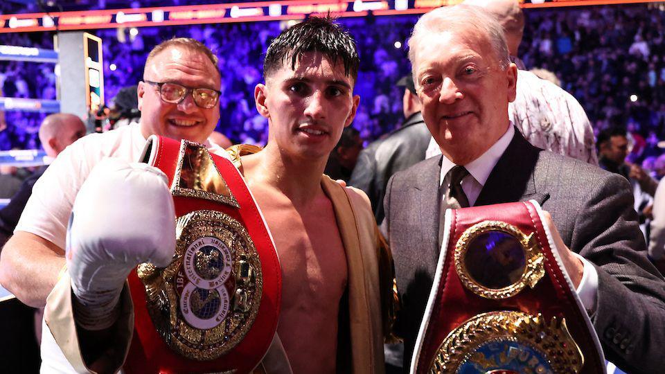 Royston Barney-Smith poses for a photo with Frank Warren after winning his new belts 