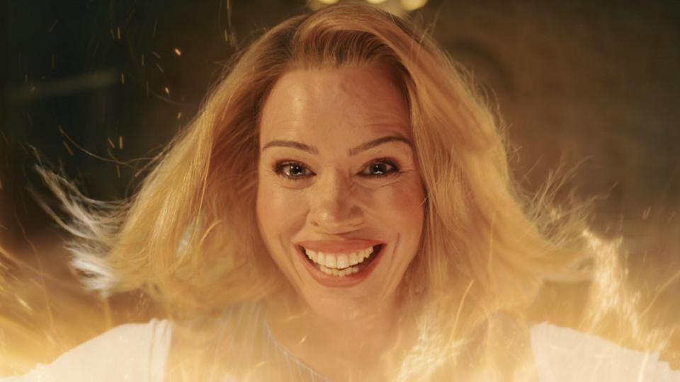 Billie Piper pictured in the final episode of Doctor Who's most recent series, smiling at the camera amidst an orange glow