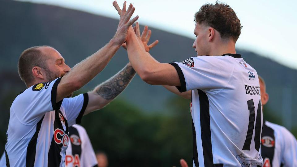 Harvey Bennett (right) is congratulated after scoring for Llandudno
