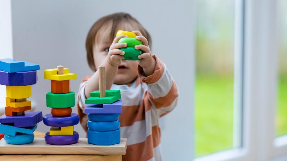 A child plays with building blocks