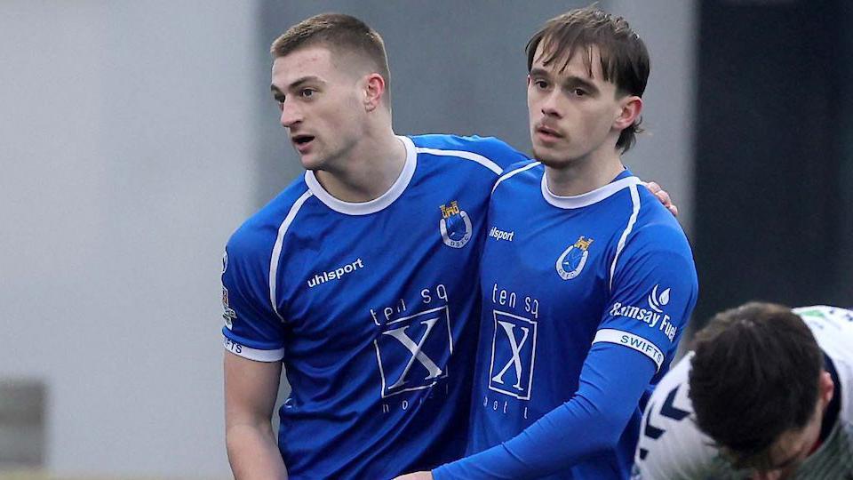 Sean McAllister is congratulated after scoring for Dungannon Swifts