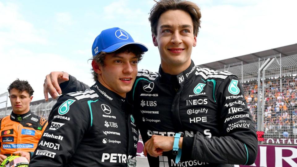 A smiling George Russell puts his arm around Mercedes' team-mate Kimi Antonelli's shoulder after they qualify on the front row for the Australian Grand Prix
