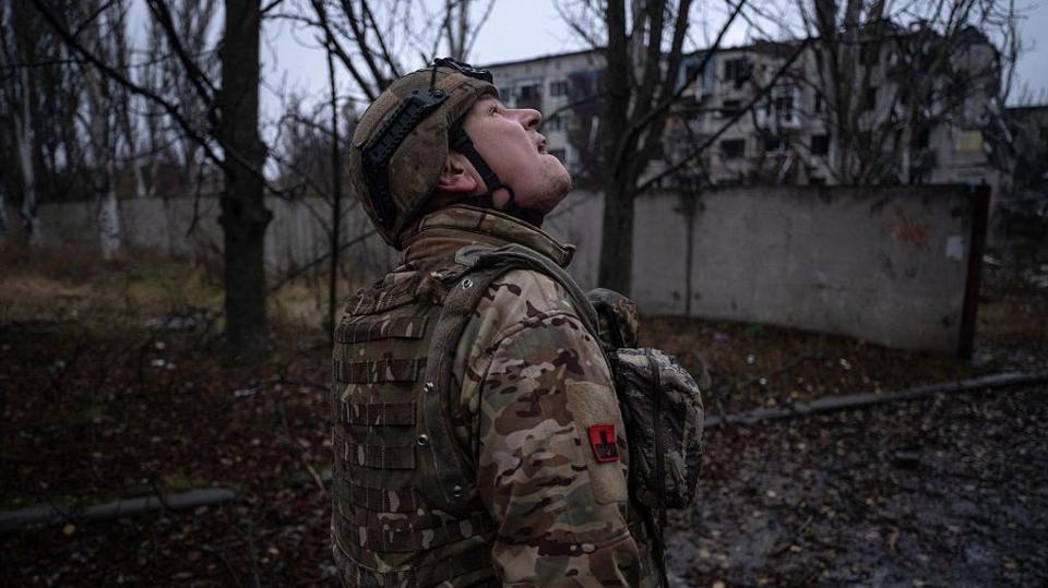 A Ukrainian serviceman checks the sky for fpv-drones in the frontline town of Kostyantynivka, Donetsk region, amid the Russian invasion of Ukraine. taken in 2025
