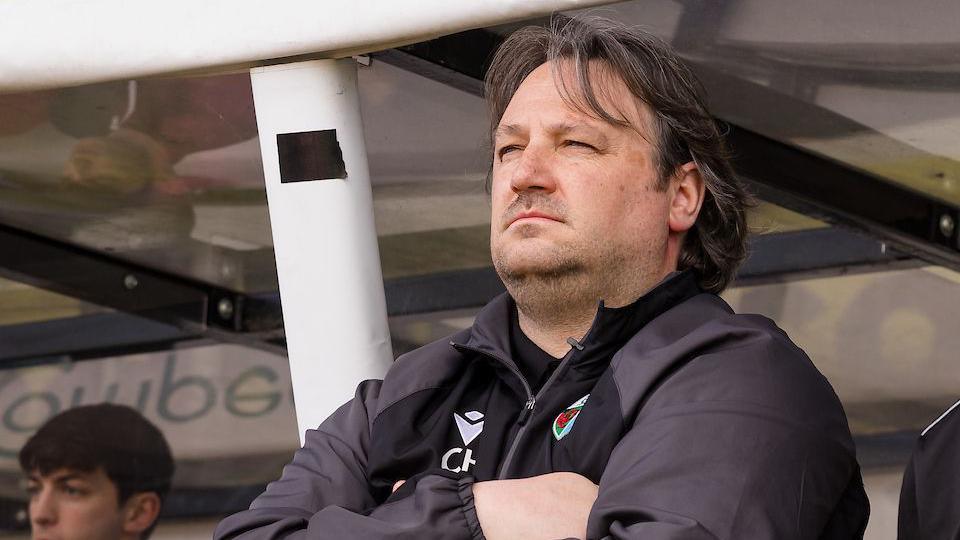 The New Saints boss Craig Harrison in the dugout 