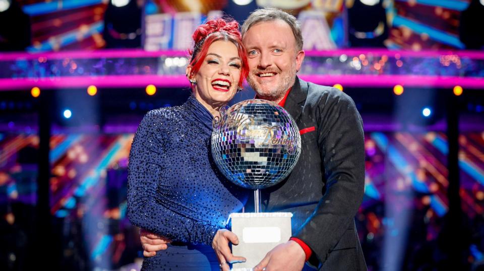 Dianne Buswell and Chris McCausland with the glitterball trophy