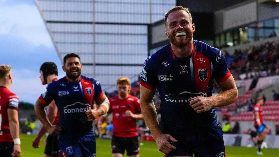Hull Kingston Rovers winger Joe Burgess celebrates a try against Salford Red Devils with teammate Peta Hiku