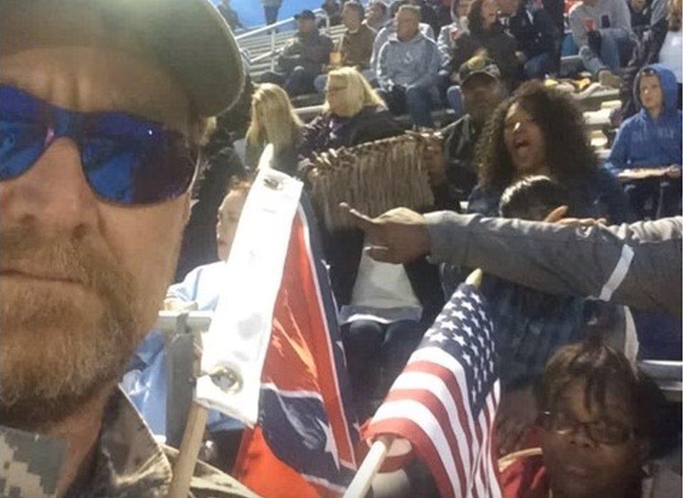 Scott Greene holding confederate flag