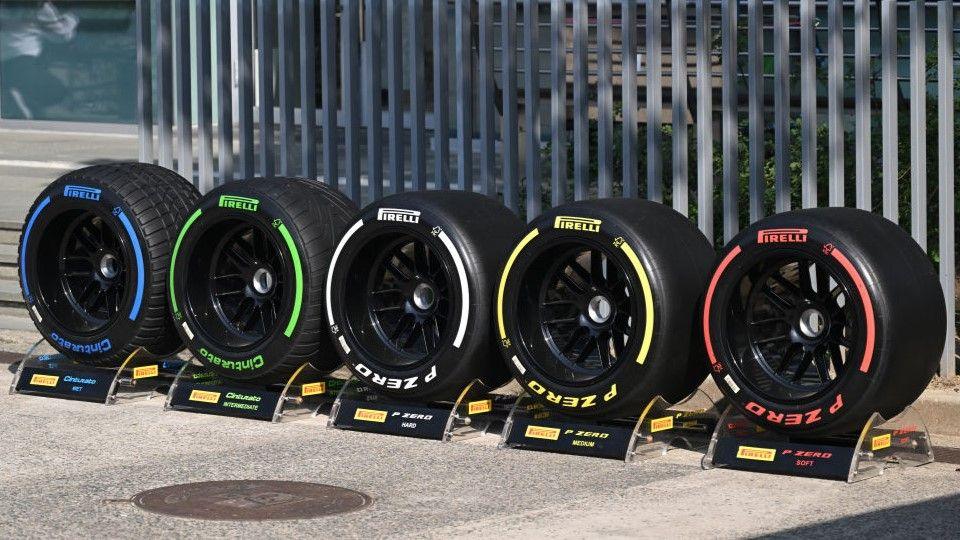 F1 tyres on display from left to right; blue full wet tyres, green intermediate tyres, white hard tyres, yellow medium tyres and red soft tyres