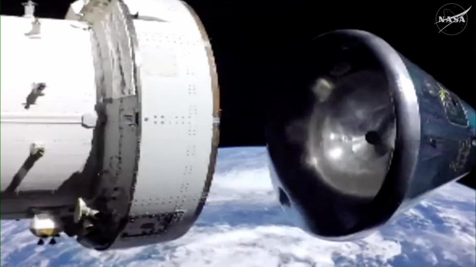 Crew module separating from spacecraft with Earth in the background