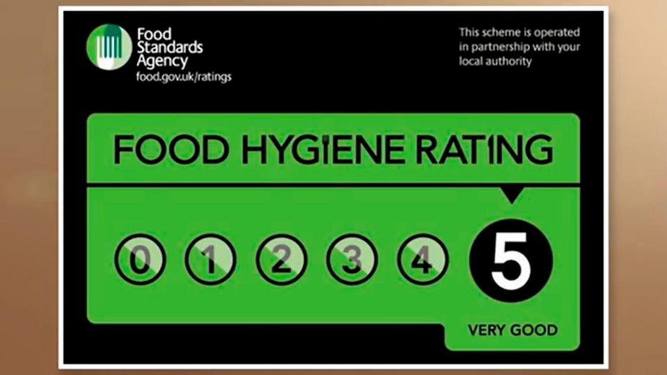 A green sticker with text Food Hygiene Rating and a 5-point scale.