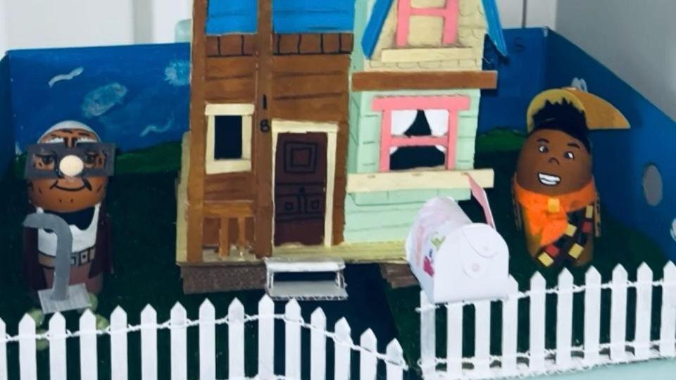 Eggs as Carl Fredricksen and Russell are shown in front of a depiction of Carl's house from Up