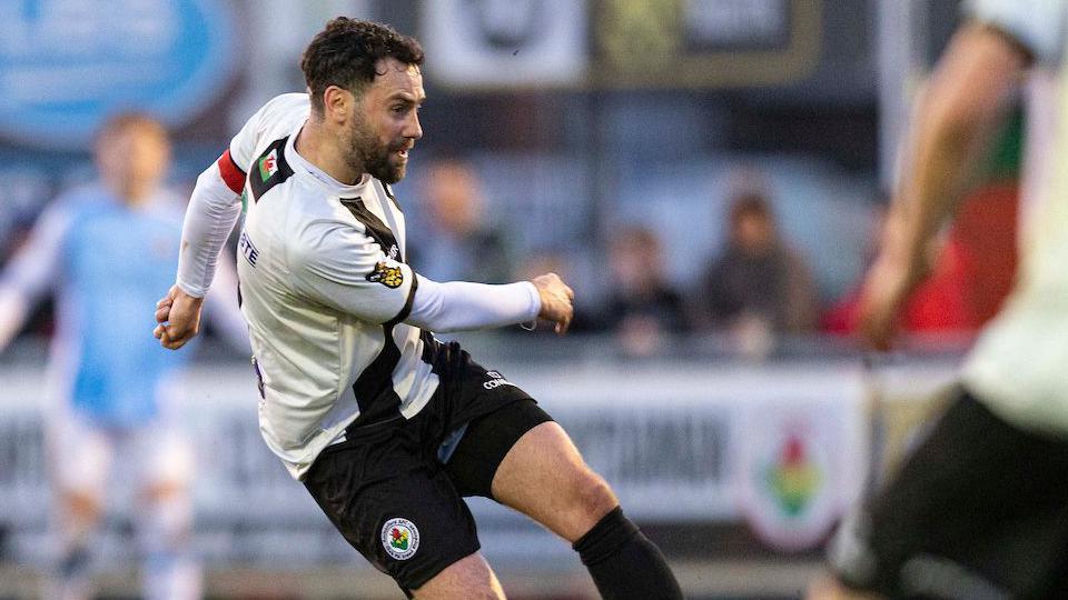 Adam Orme in action for Ammanford