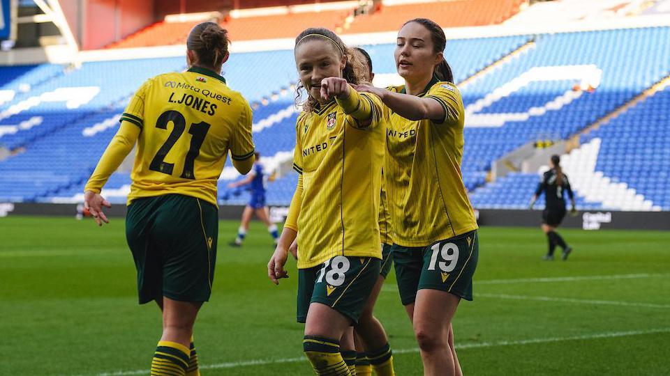 Wrexham's Katie Barker (centre) celebrates