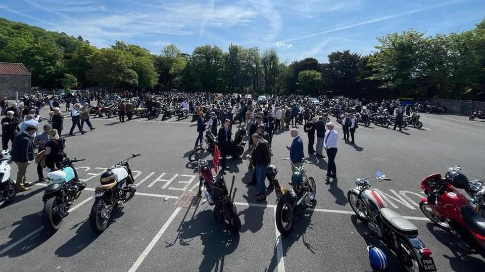 A car park full of modern and vintage motorcycles