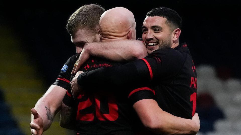 Lewis Hall of Widnes Vikings celebrating a try against Rochdale Hornets with team-mate Declan Patton