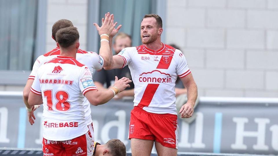 Joe Burgess celebrating a try for Hull KR with teammate Jack Broadbent.