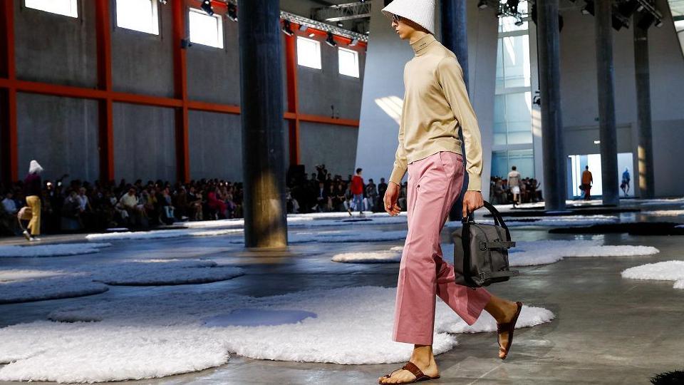 A model wearing Prada walks on the runway at the Milan Fashion Week in June.