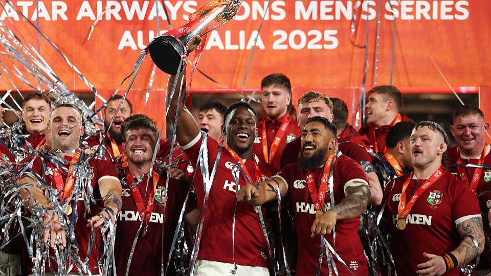 Maro Itoje lifts the Tom Richards Cup following the Lions' 2-1 series win