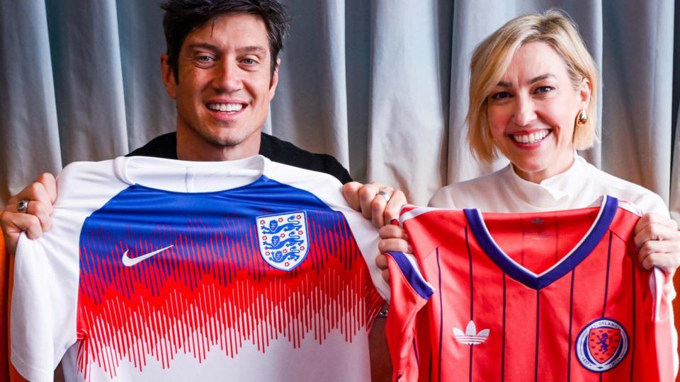 Vernon Kay holding an England shirt and Kelly Cates holding a Scotland shirt