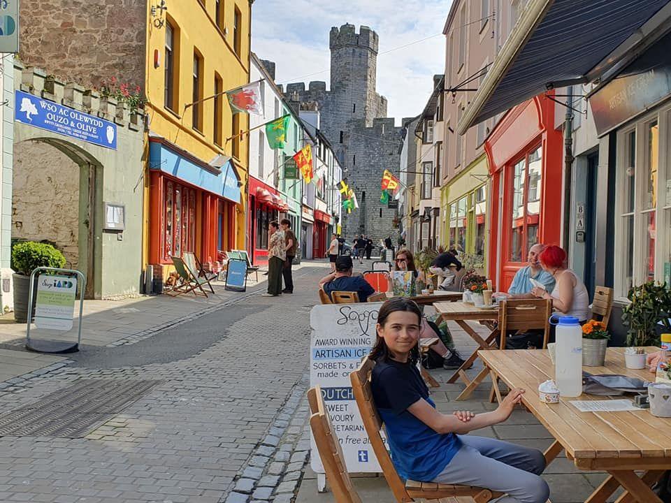 Finn outside a cafe in Caernarfon