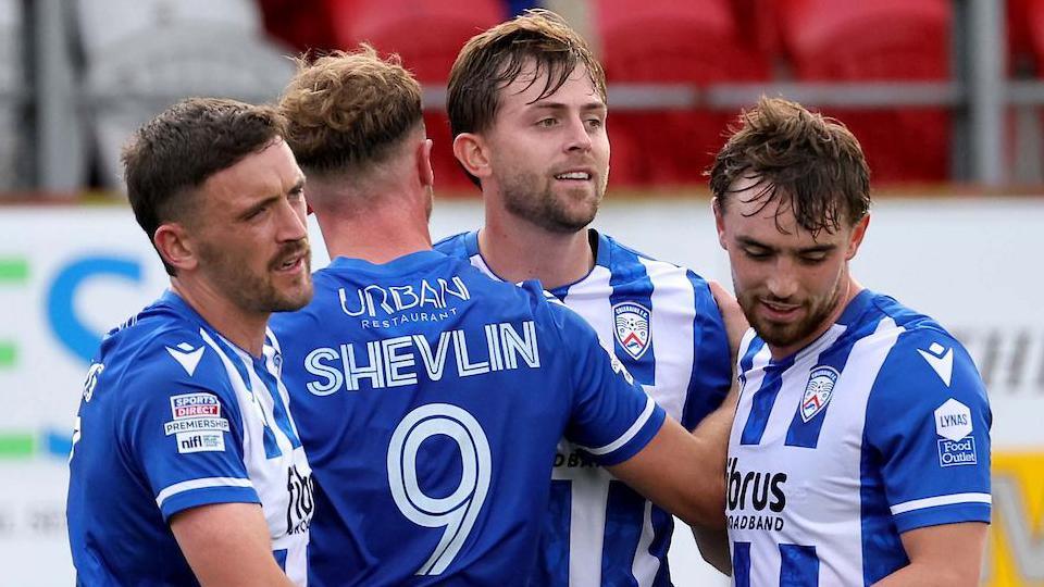 Coleraine players celebrate Will Patching's opening goal