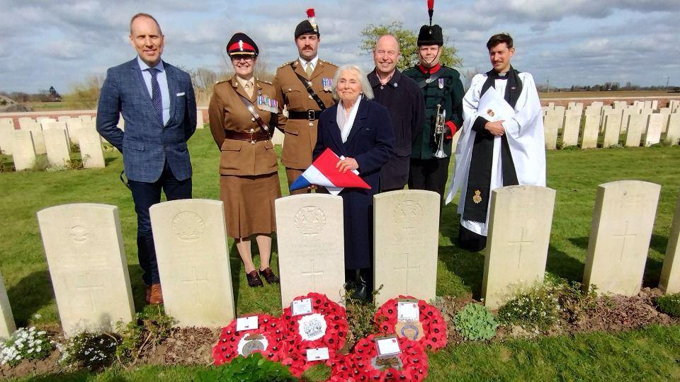 Liz Ashforth, a relative of Capt Daggett, by his grave at the rededication ceremony