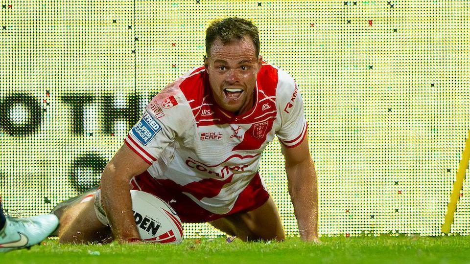 Joe Burgess celebrates a try against St Helens