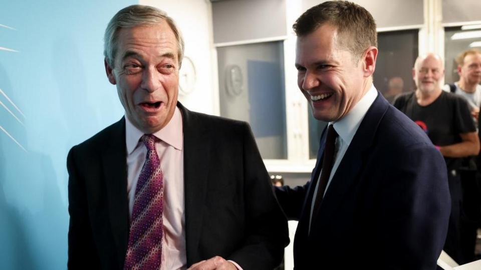 Former British Conservative Party member Robert Jenrick with Reform UK leader Nigel Farage at a press conference, as Jenrick has announced he has defected from the country's Conservative Party to the right-wing Reform UK Party, in London, January 15, 2026.