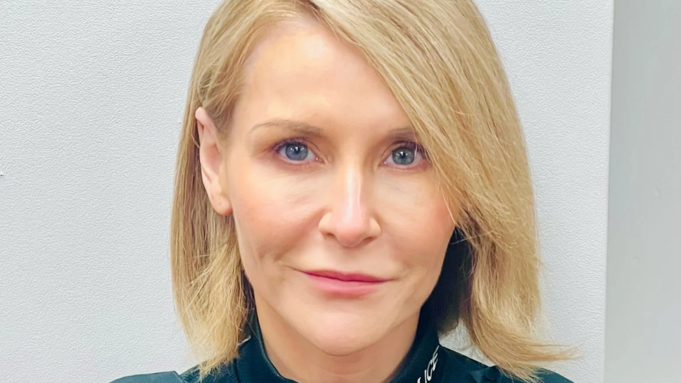 Supt Sinead McIldowney has blue eyes and straight blonde hair. 
She is wearing her Police Service of Northern Ireland (PSNI) uniform. 