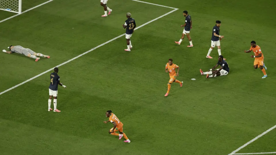 Ivory Coast players celebrate Amad Diallo's winning goal as Ecuador's players react in dejection
