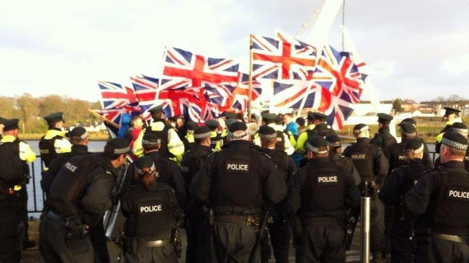 Loyalists march over Londonderry peace bridge