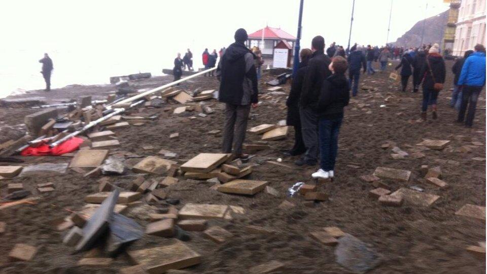 debris along the front in Aberystwyth after the storm surge