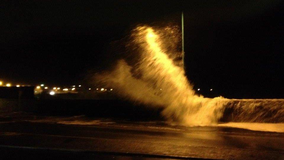 Waves crashed over harbour walls in Guernsey