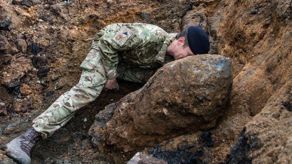 Army engineer working on the bomb