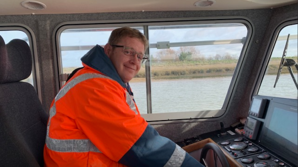 James Bateman, the Rye Harbour Master is piloting a vessel in the harbour in East Sussex