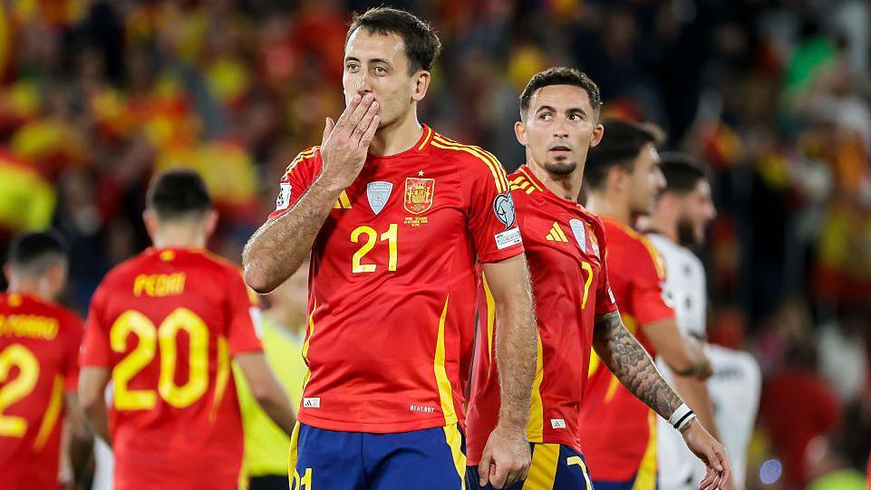 Mikel Oyarzabal blows a kiss to the fans as Spain celebrate