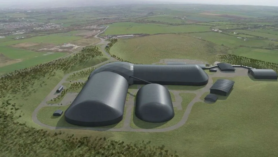 Artist impression of several grey hemispherical buildings in a field