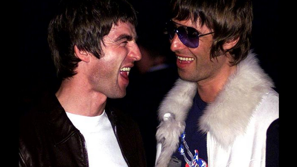 Noel and Liam Gallagher pictured laughing together in 2001