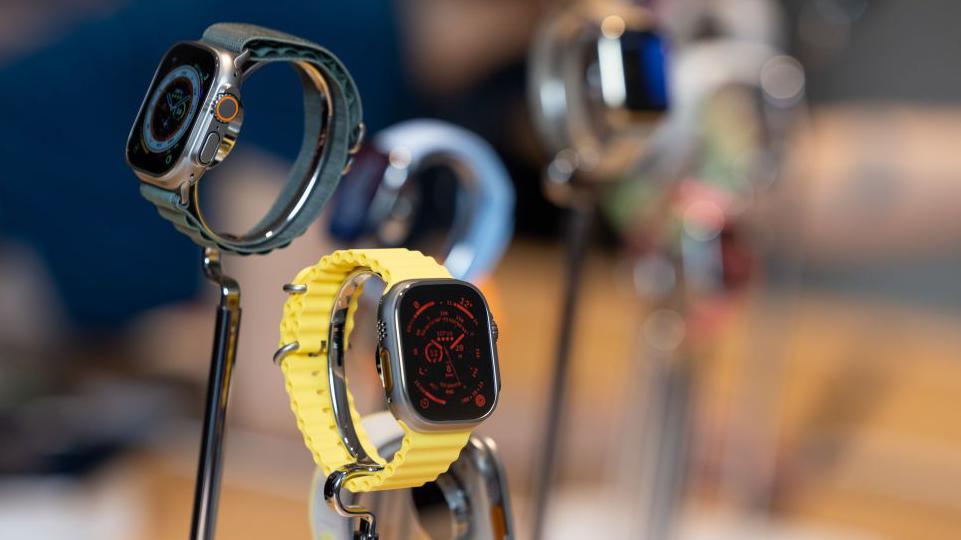 Apple Watches on display at a store