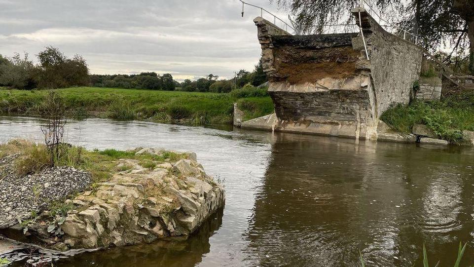 A destroyed bridge seen above the River Clwyd in Denbighshire.