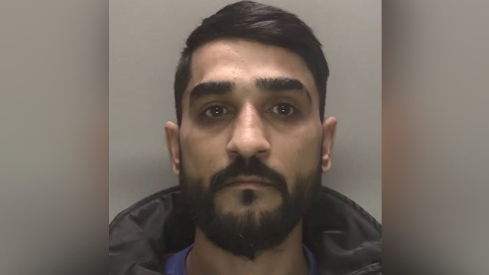 A police custody image of Jagdeep Singh against a grey background