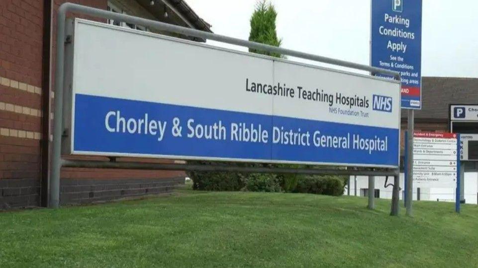 A sign says Chorley and South Ribble District General Hospital and Lancashire Teaching Hospitals NHS Foundation Trust.