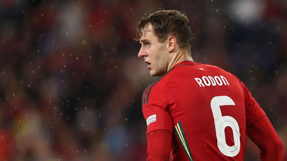 Joe Rodon playing for Wales